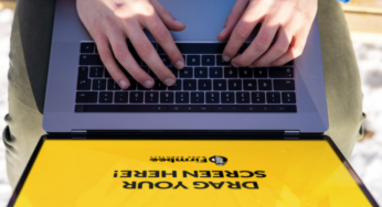 Man uses Apple MacBook – view from above