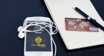 iPhone notebook and visa card