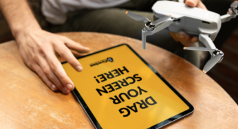 Man with Mavic drone and Apple iPad